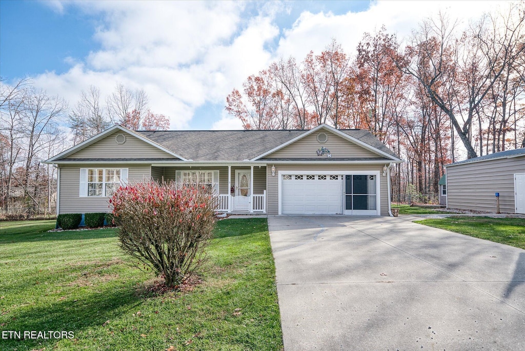 single story home with a garage and a front yard