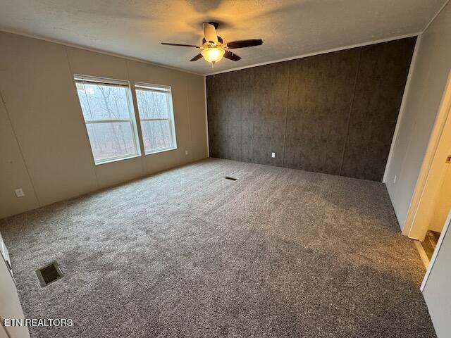 unfurnished bedroom featuring carpet flooring and ceiling fan