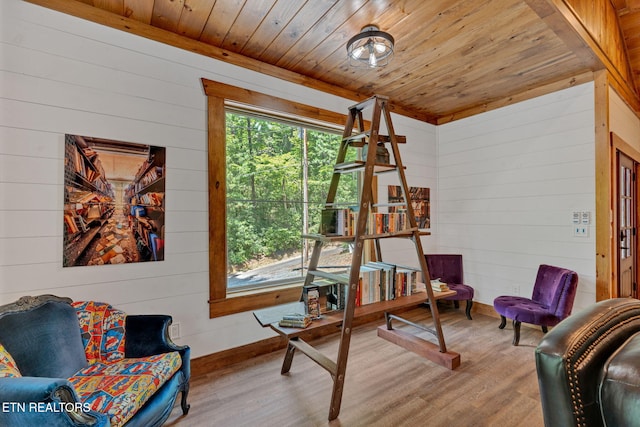 living area featuring wood walls, wooden ceiling, and light wood-type flooring