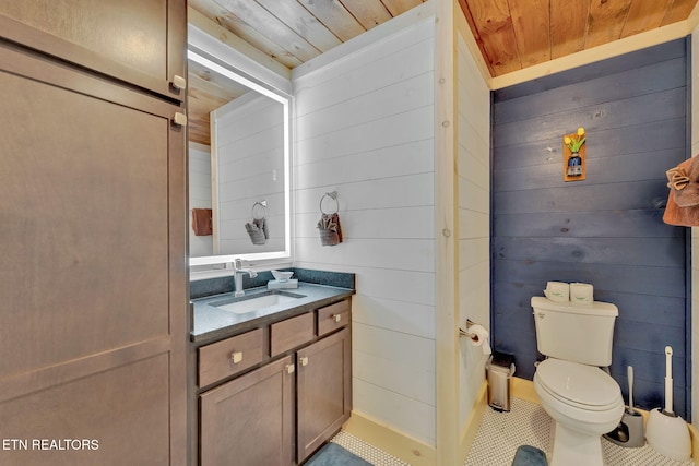 bathroom with wood walls and wood ceiling