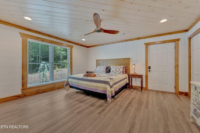 bedroom featuring light hardwood / wood-style flooring, ceiling fan, wood walls, and wood ceiling