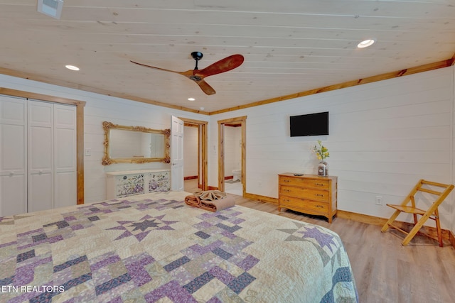 unfurnished bedroom with ceiling fan, a closet, and light wood-type flooring