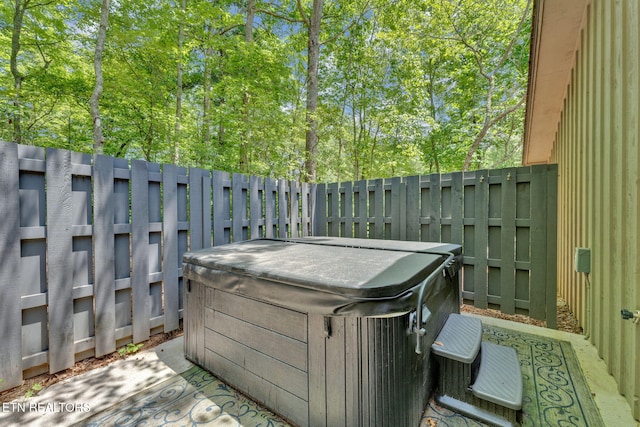 exterior space with a hot tub