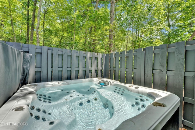 exterior details featuring a jacuzzi