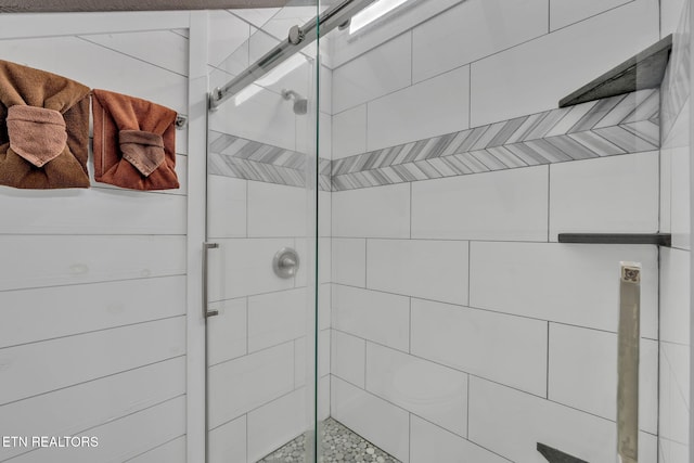 bathroom featuring an enclosed shower