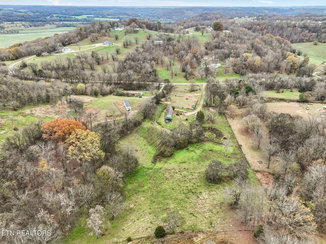 birds eye view of property featuring a rural view