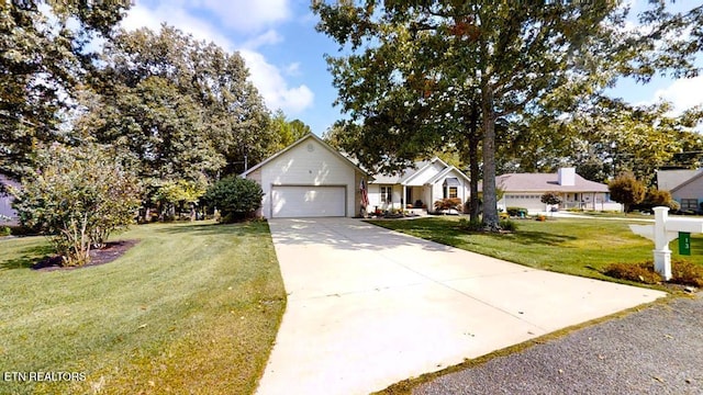 view of front of home featuring a garage and a front lawn