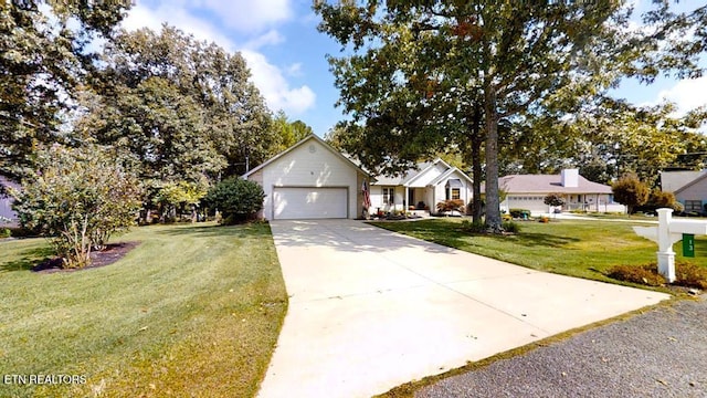 13 Windsor Pt, Crossville, TN 38558 - ranch-style home featuring concrete driveway, a front lawn, and an attached garage