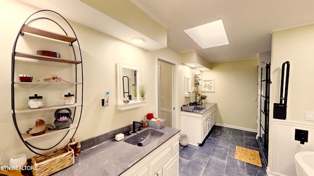 13 Windsor Pt, Crossville, TN 38558 - bathroom with vanity, a skylight, crown molding, a bathtub, and stone finish floors