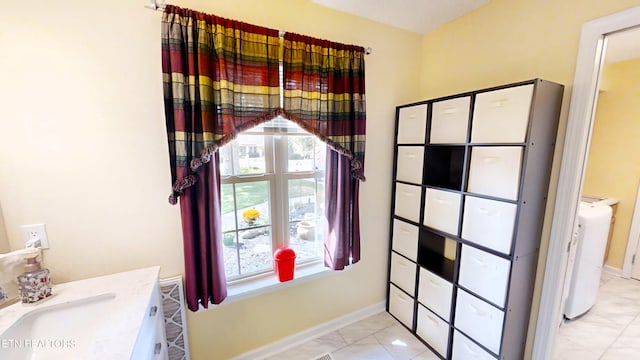 bathroom with plenty of natural light and vanity