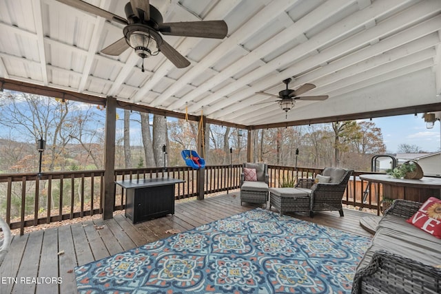 wooden terrace featuring an outdoor hangout area and ceiling fan