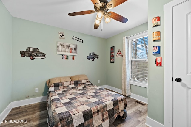 bedroom with hardwood / wood-style flooring and ceiling fan