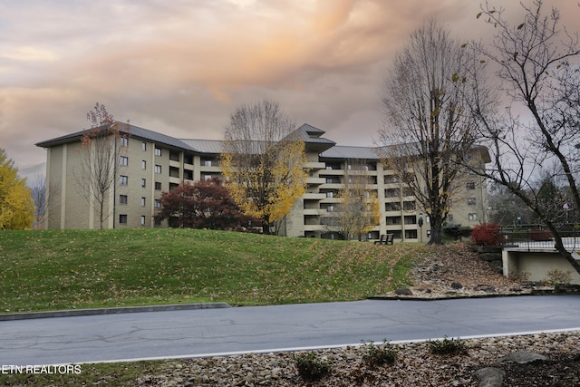 view of outdoor building at dusk