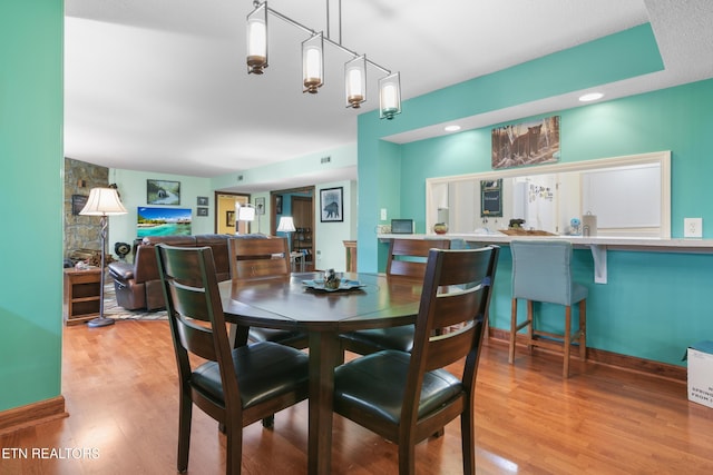 dining room with hardwood / wood-style flooring