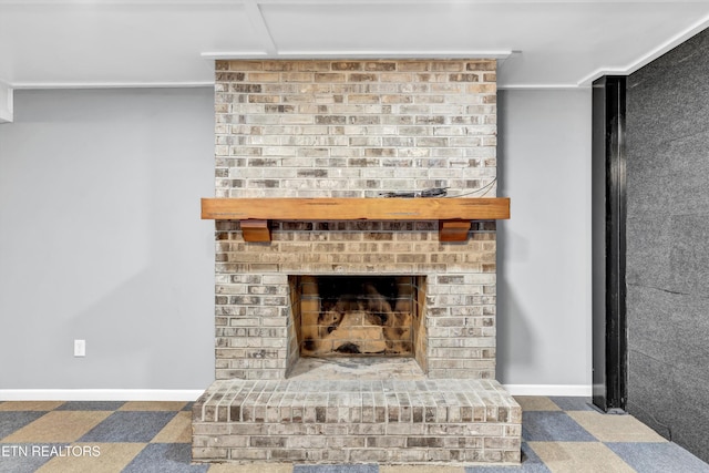 room details featuring a fireplace and carpet