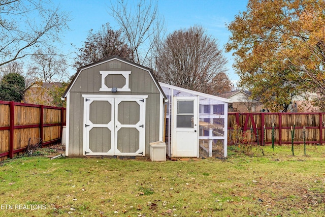 view of outbuilding featuring a yard