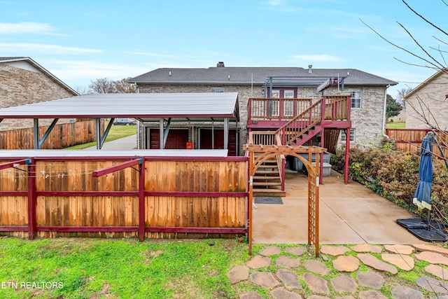 back of property featuring a wooden deck