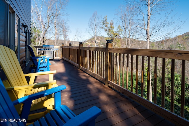 deck featuring a grill