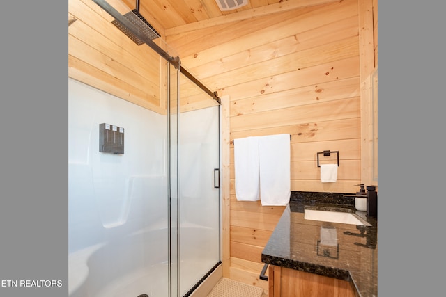 bathroom featuring vanity, wood ceiling, an enclosed shower, and wood walls