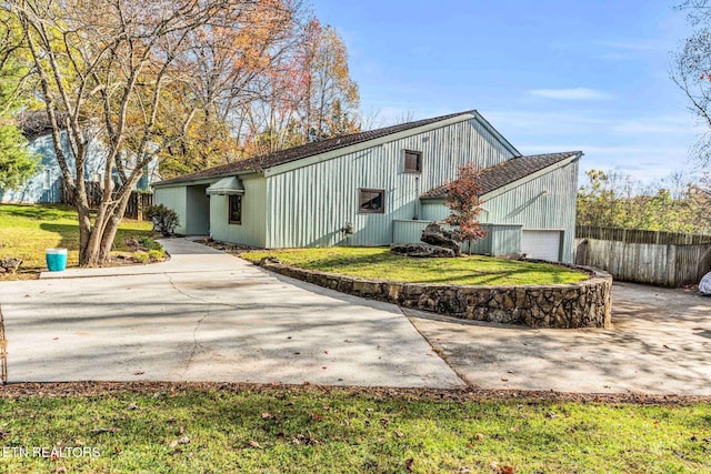 exterior space with a garage and a front yard