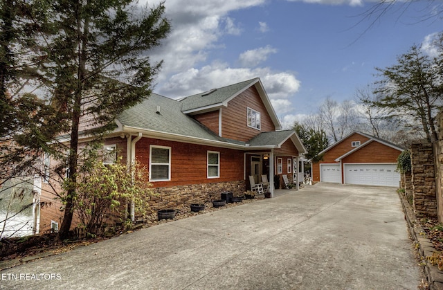 view of front of property with an outdoor structure and a garage