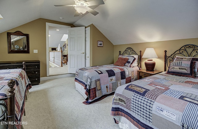 carpeted bedroom with vaulted ceiling and ceiling fan