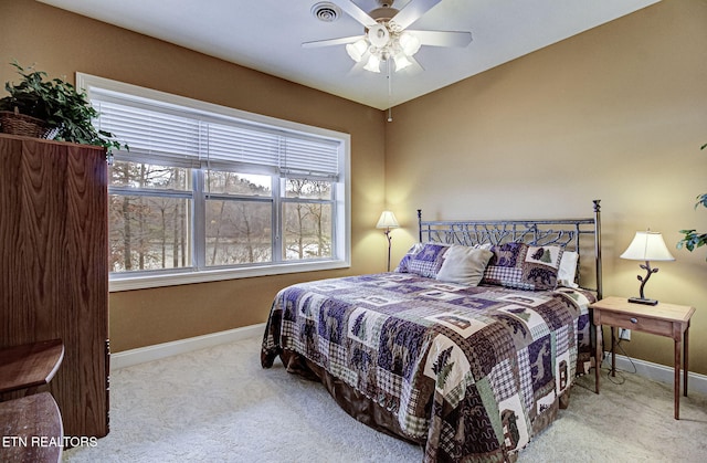 carpeted bedroom with ceiling fan