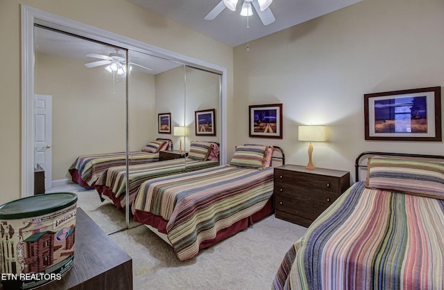 carpeted bedroom with a closet and ceiling fan