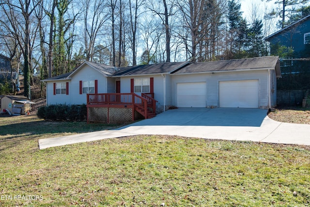 ranch-style house with a front lawn, driveway, a deck, and an attached garage