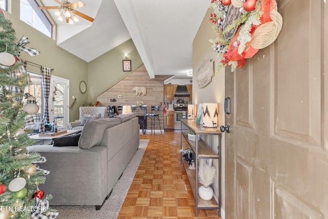 living room with ceiling fan, lofted ceiling, and light parquet flooring