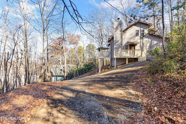 exterior space featuring a wooden deck