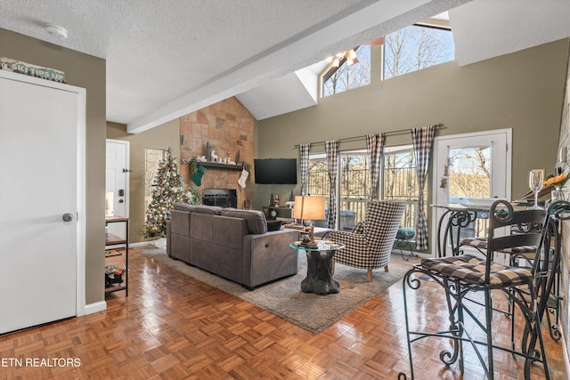 living room featuring beamed ceiling, high vaulted ceiling, a fireplace, and parquet flooring