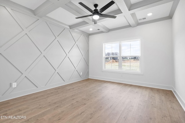 spare room with beamed ceiling, ceiling fan, light wood-type flooring, and coffered ceiling