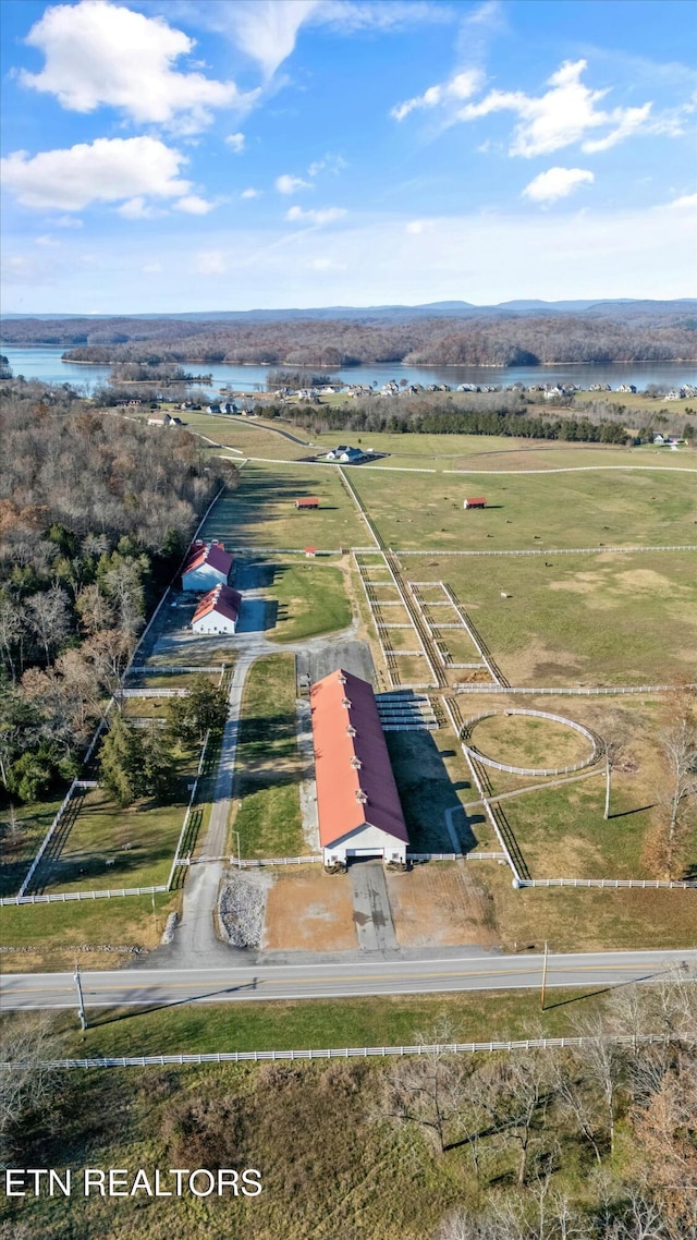 birds eye view of property featuring a rural view and a water view