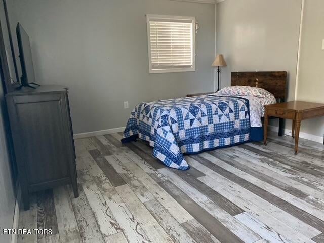 bedroom featuring hardwood / wood-style flooring