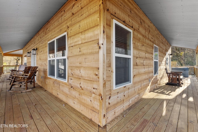 wooden terrace with a porch