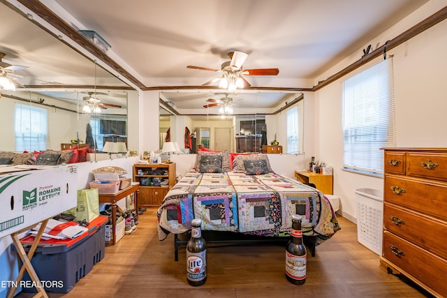 bedroom featuring hardwood / wood-style floors and ceiling fan