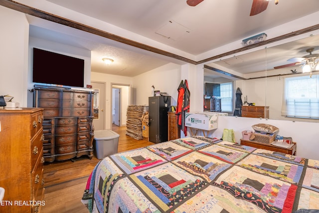 bedroom with ceiling fan and light hardwood / wood-style floors