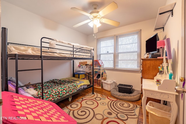 bedroom featuring ceiling fan and hardwood / wood-style flooring