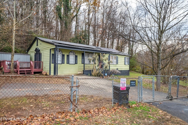 view of front of home with solar panels and a deck