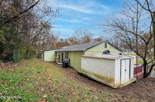 view of property exterior featuring a storage shed