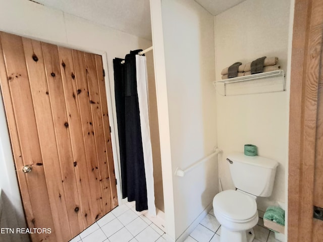 3018 Rivers Edge Dr, Cosby, TN 37722 - bathroom with toilet, a shower with shower curtain, and tile patterned floors