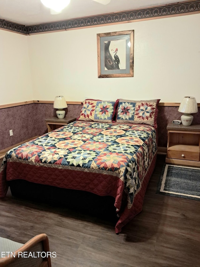 3018 Rivers Edge Dr, Cosby, TN 37722 - bedroom featuring wood finished floors and wainscoting