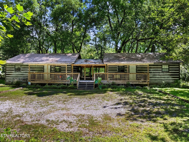 view of front of property with a wooden deck