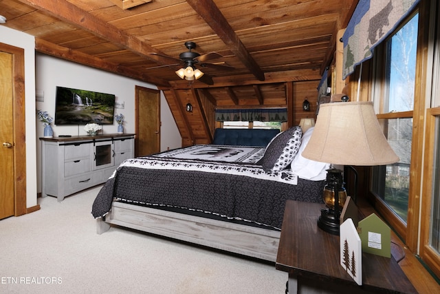 bedroom with beam ceiling, ceiling fan, light colored carpet, and wood ceiling