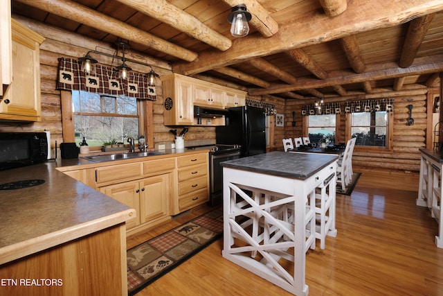 kitchen featuring black appliances, light hardwood / wood-style floors, wood ceiling, and sink