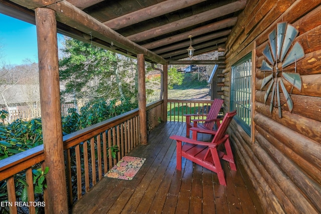 wooden deck featuring a porch