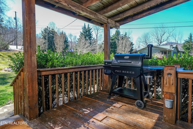 wooden deck featuring grilling area