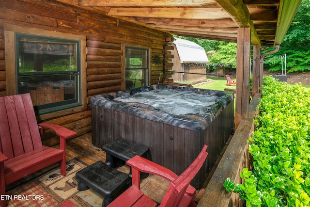 view of patio with a hot tub