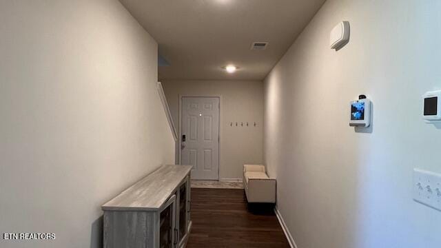 hall featuring dark wood-type flooring